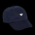 Navy blue cotton baseball cap with a white heart emblem embroidered by Atticus Poetry 