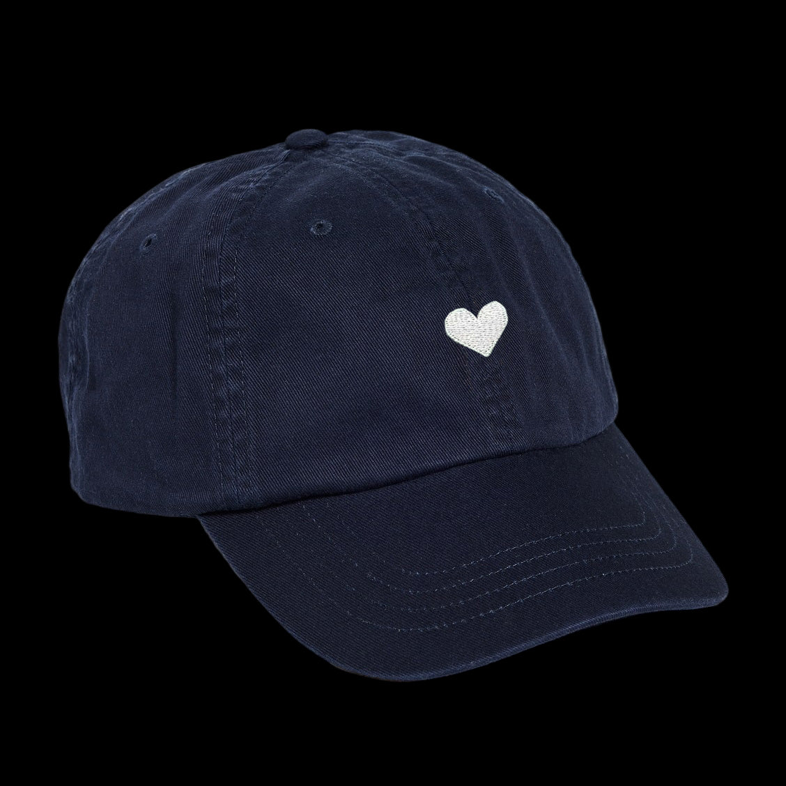 Navy blue cotton baseball cap with a white heart emblem embroidered by Atticus Poetry 